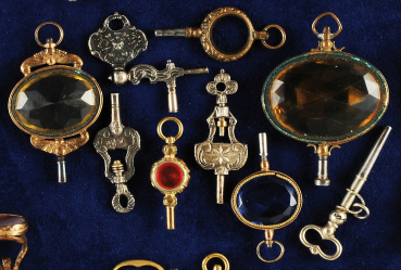 Konvolut mit 9 Taschenuhr-Schlüsseln,