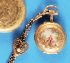 Gold-Emaille-Damentaschenuhr mit Sprungdeckel und langer, vergoldeter Kette mit Schmucksteinschieber in Herzform,