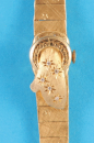 Damen-Goldarmbanduhr mit integriertem Goldband und dekorativem Zifferblatt-Deckel