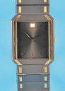 Seiko Quartz, flache Herrenarmbanduhr mit Stahlgliederband mit vergoldeten Verzierungen,